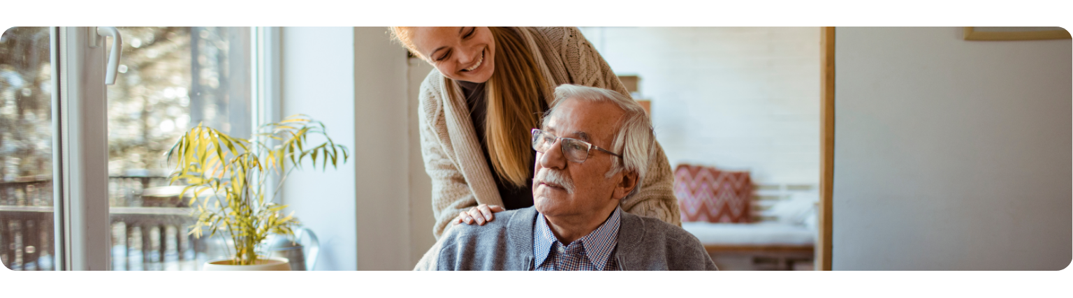 Carer helping elderly man