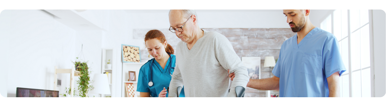 Nurse helping elderly man to walk