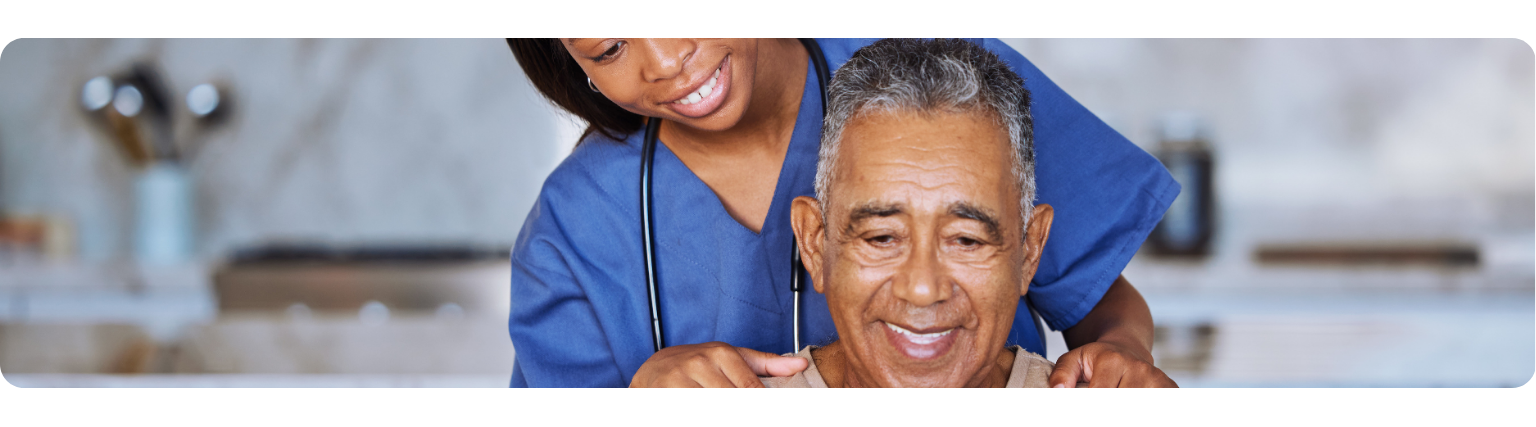 Nurse comforting elderly man