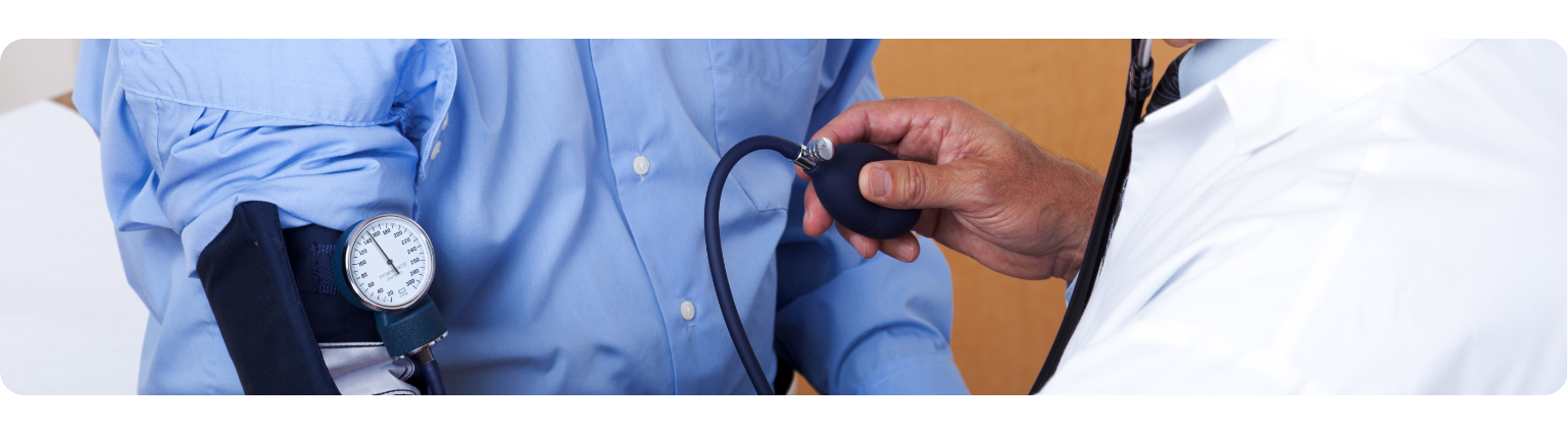 Doctor taking patient's blood pressure