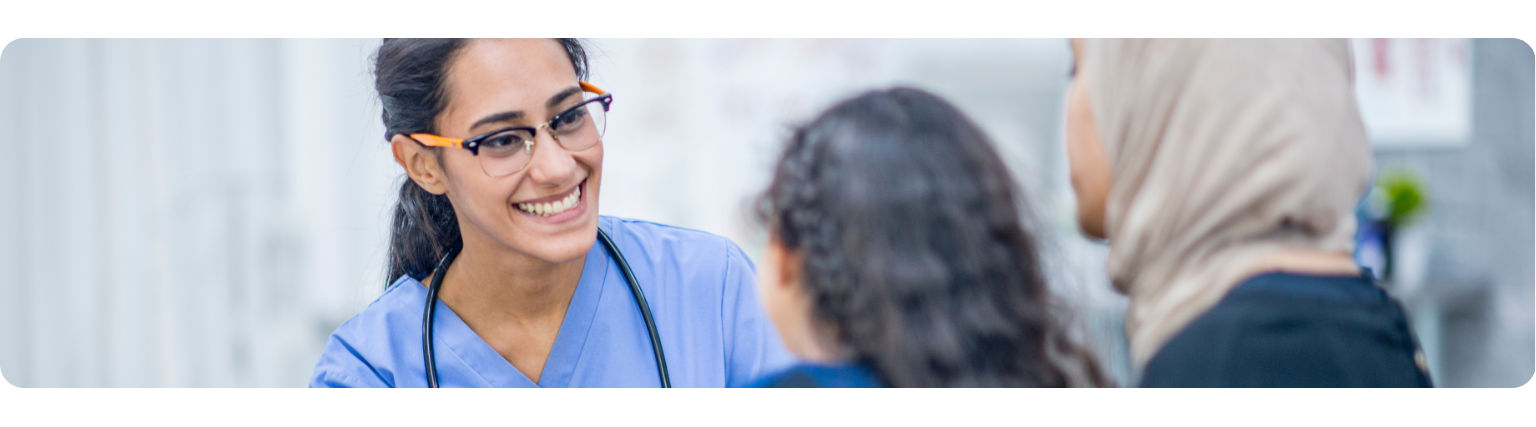 Nurse smiling with elderly patient
