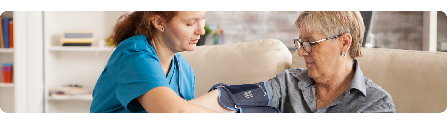 Nurse taking patient's blood pressure